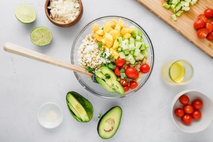 Mango Lime Quinoa Salad is gluten free and a fun spin on pasta salad. Full of light and refreshing veggies, it's a great summer quinoa salad option | Cold Quinoa Salad | Summer Quinoa Salad