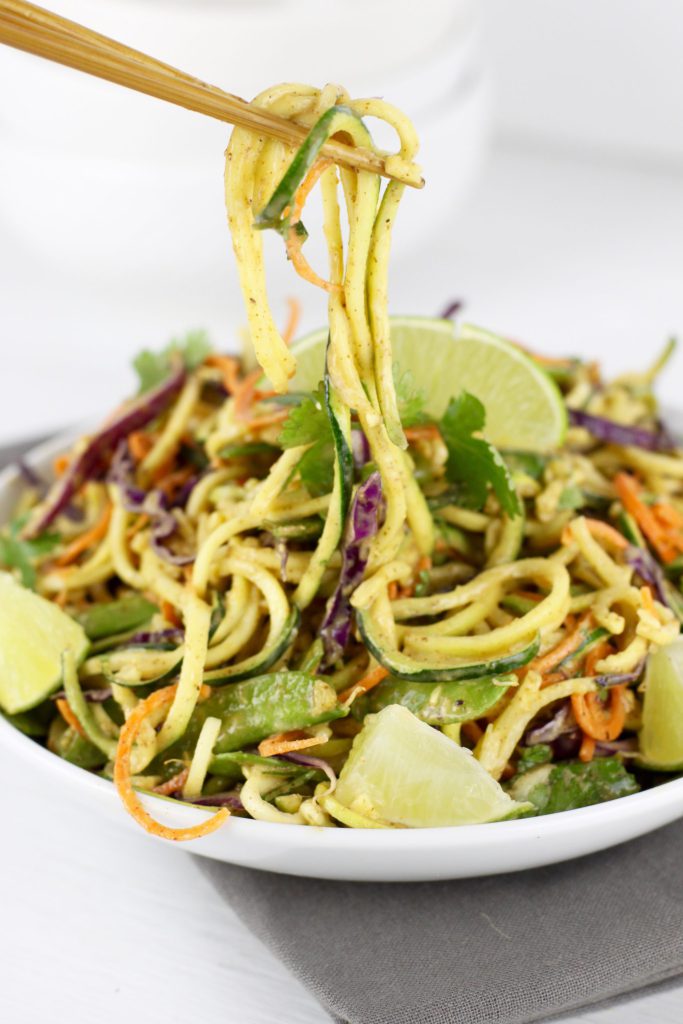 Zucchini noodles with spiralized veggies in white bowl