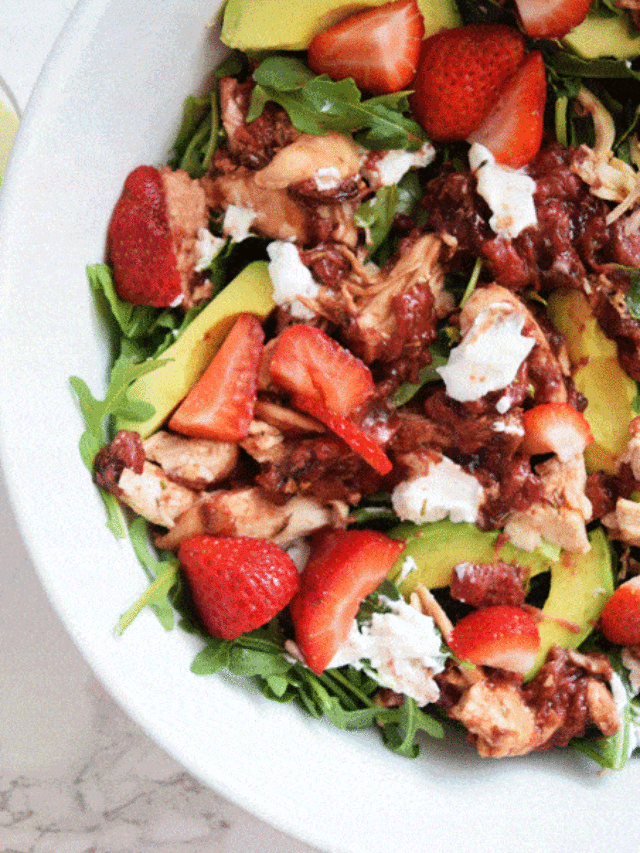 Strawberry Chicken Salad with goat cheese in white bowl