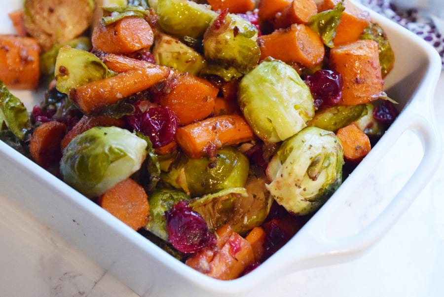 roasted brussels sprouts and carrots in white bowl