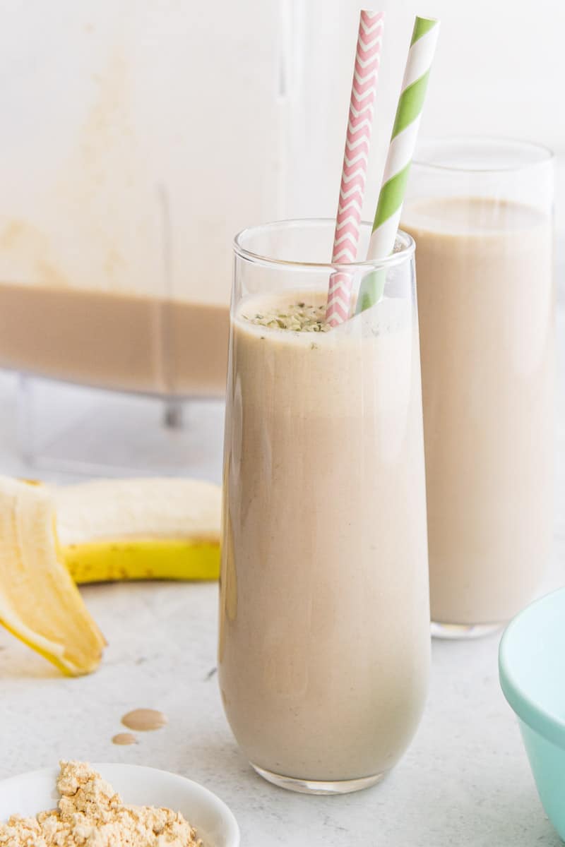 peanut butter coffee smoothie in clear glass with straws
