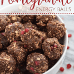 bowl of chocolate energy bites with pomegranate seeds