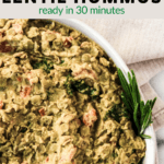 closeup of lentil hummus dip in white bowl with text overlay