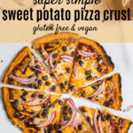 Overhead view of sweet potato pizza crust topped with cheese, black beans and red onions on gray background with text overlay | Bucket List Tummy