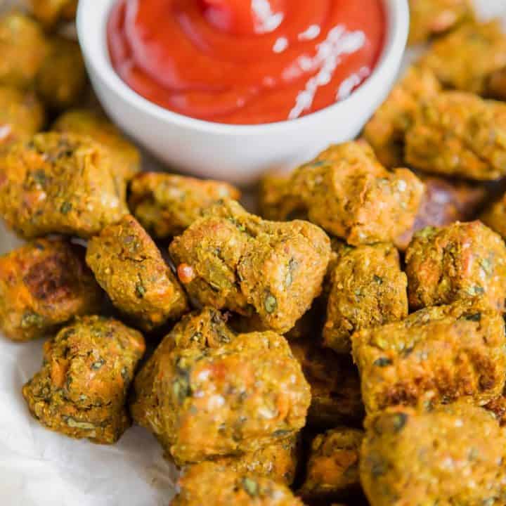 Spinach Sweet Potato Tots close up with ketchup in white bowl | Bucket List Tummy