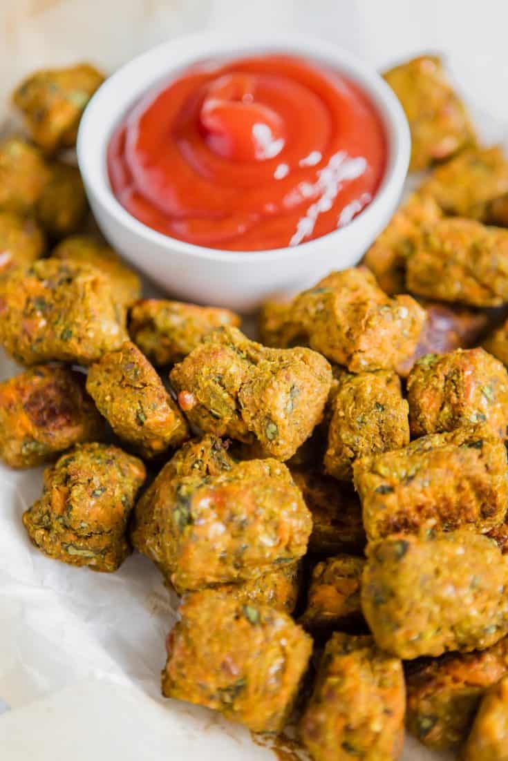 Spinach Sweet Potato Tots close up with ketchup in white bowl | Bucket List Tummy