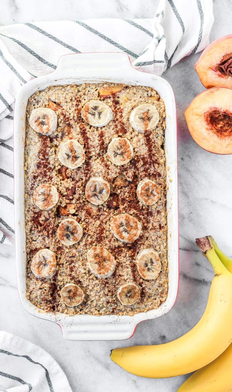 Steelcut Banana Oatmeal topped with banana slices and cinnamon on white counter | Bucket List Tummy