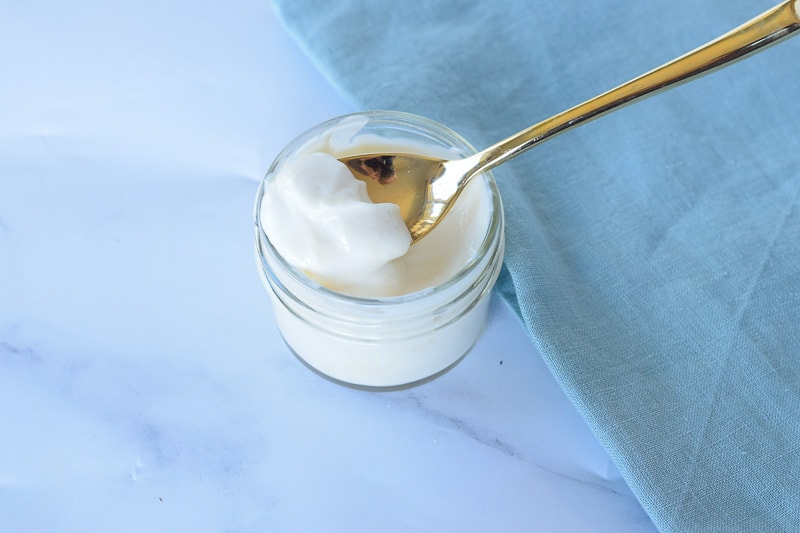 plain greek yogurt in mini ramekin with gold spoon