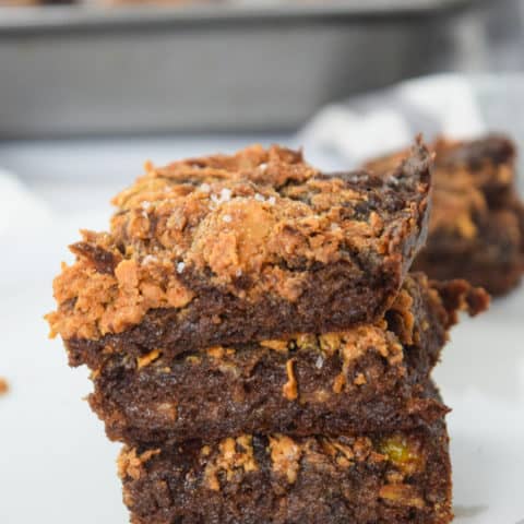 Healthy banana peanut butter brownies staked with sea salt on top | Bucket List Tummy