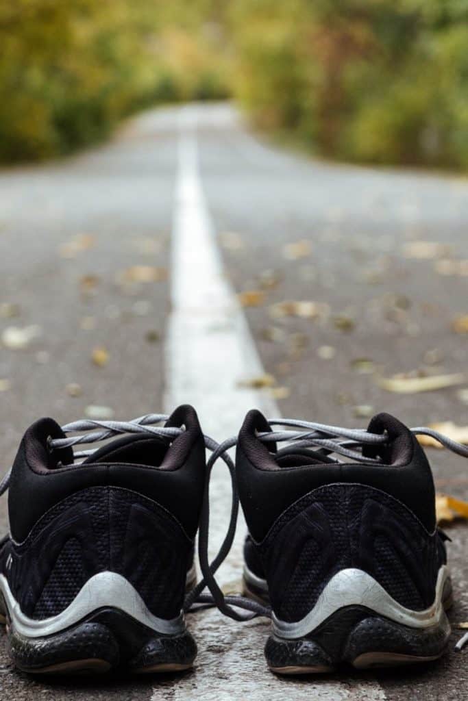 black running shoes with road ahead | Bucket List Tummy