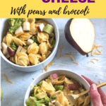 Mac and cheese in bowls with broccoli and pear