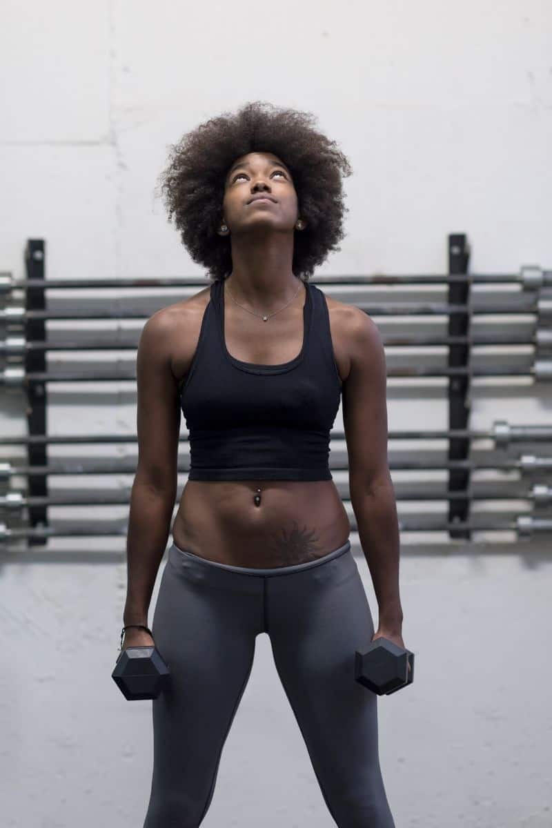 black woman lifting weights