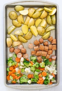 potatoes, chicken sausage and veggies on a sheet pan