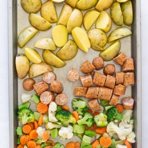 potatoes, chicken sausage and veggies on a sheet pan