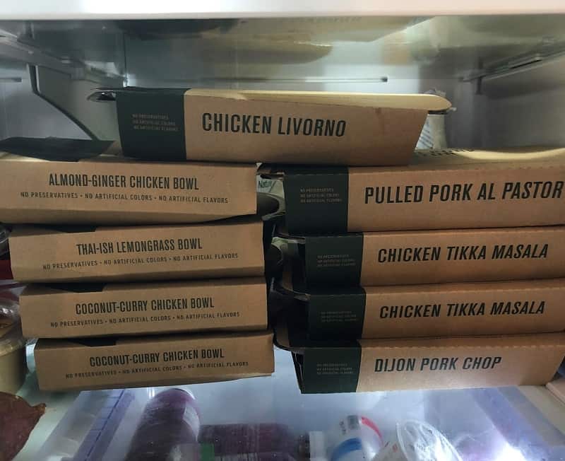 Stack of Freshly boxes in refrigerator