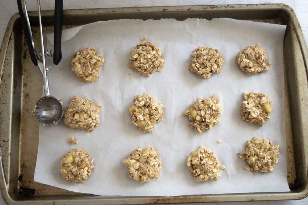 overhead view of 3 ingredient cookies with banana and oatmeal on baking sheet