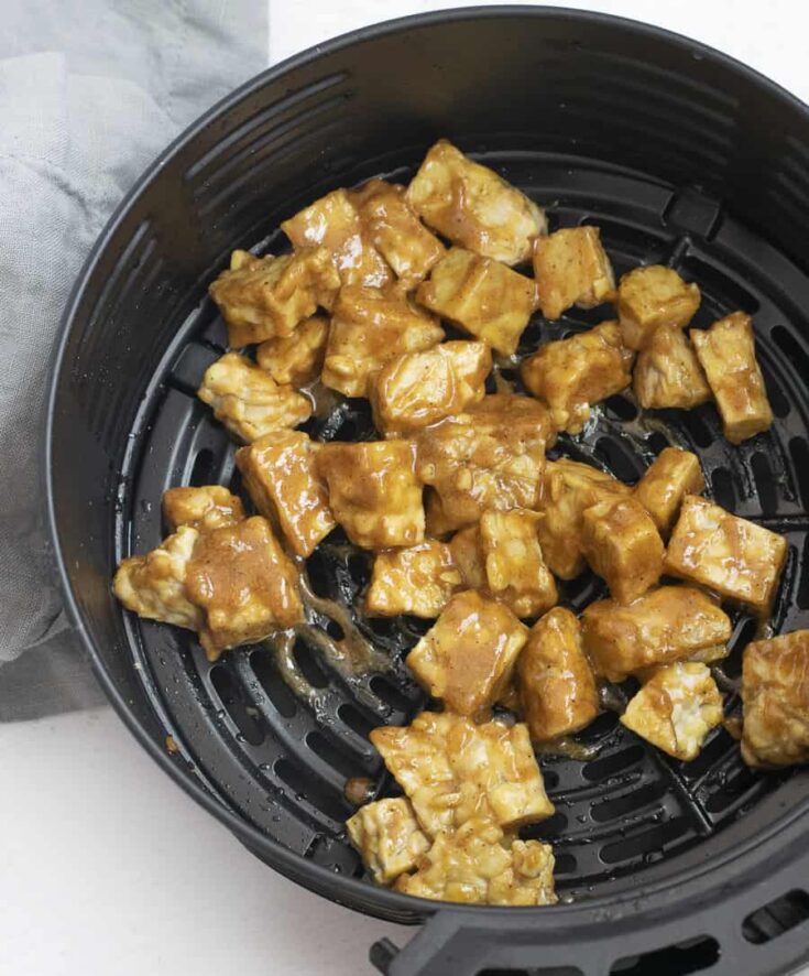 air fried tempeh covered in peanut sauce for tempehin