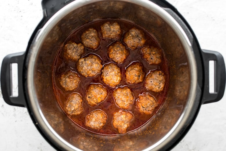 instant pot meatballs in bbq sauce in bottom of instant pot