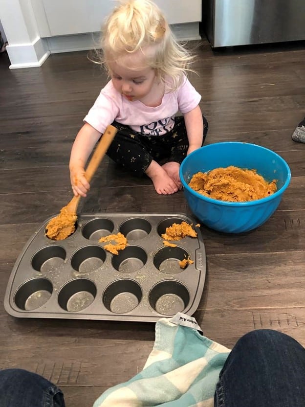toddler making baby led weaning sweet potato muffins
