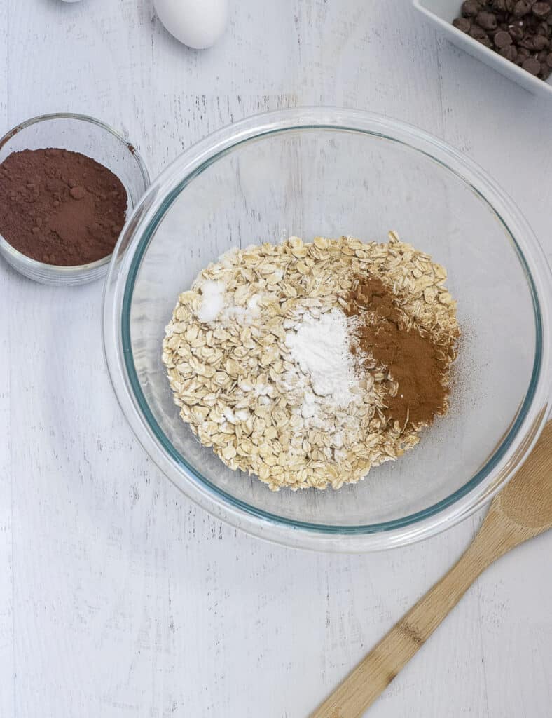 mixing bowl with dry ingredients for baked chocolate oats