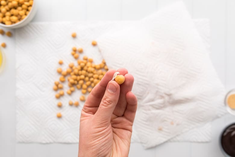 taking skin off chickpeas to make bbq roasted chickpeas