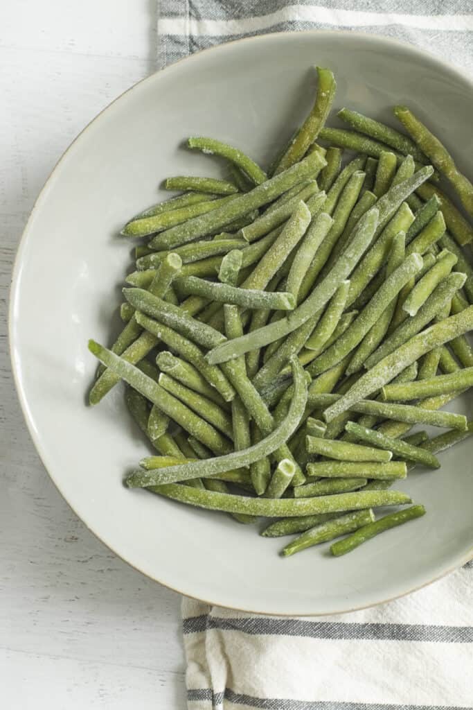 frozen green beans on light colored plate