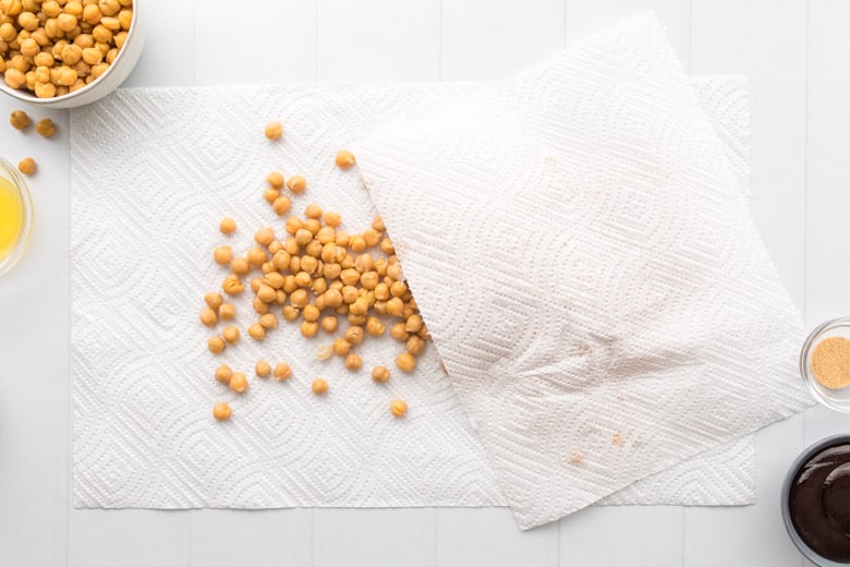 rinsed and dried chickpeas on parchment paper