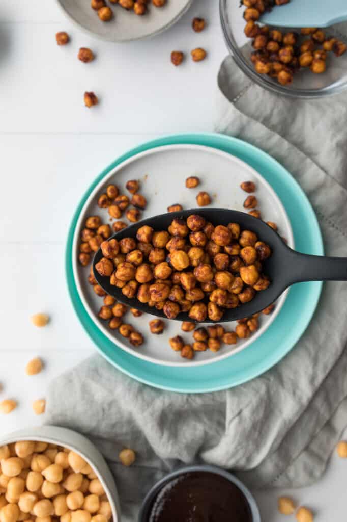 sweet and spicy roasted chickpeas with bbq in black spoon