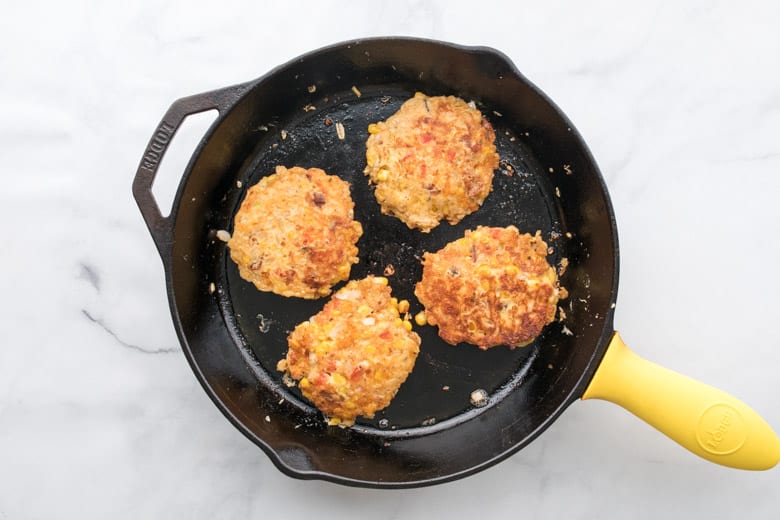 corn fritters with bacon on cast iron skillet