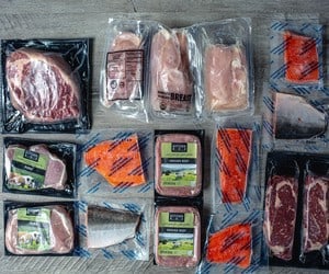 butcher box meats in packaging on table
