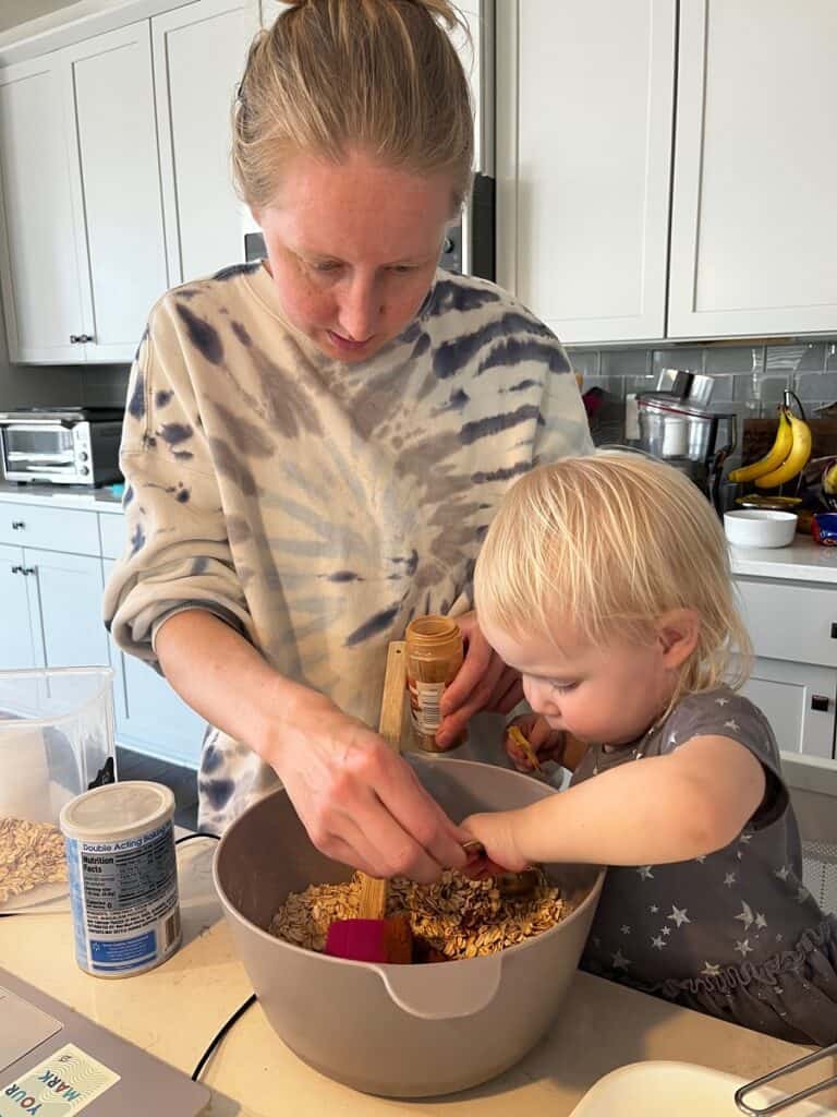 making cookie batter with toddler in kitchen