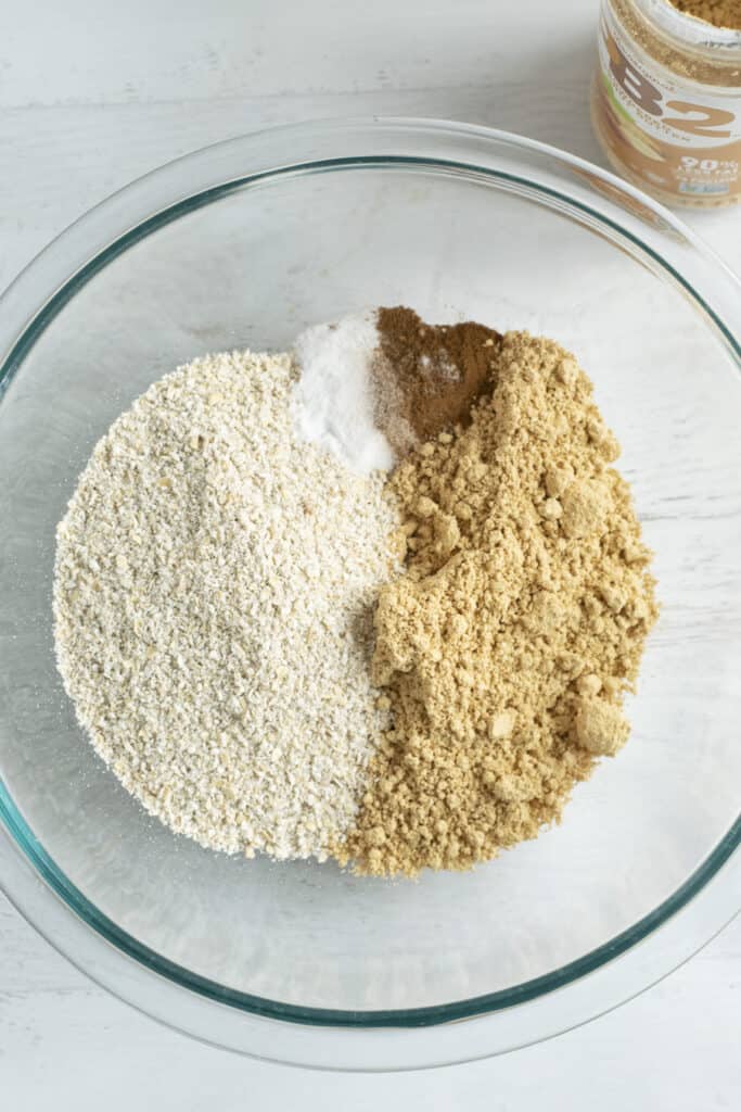 oat flour, peanut flour, cinnamon and salt in mixing bowl