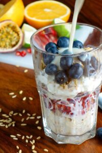 vegan yogurt parfair with berries on wooden table