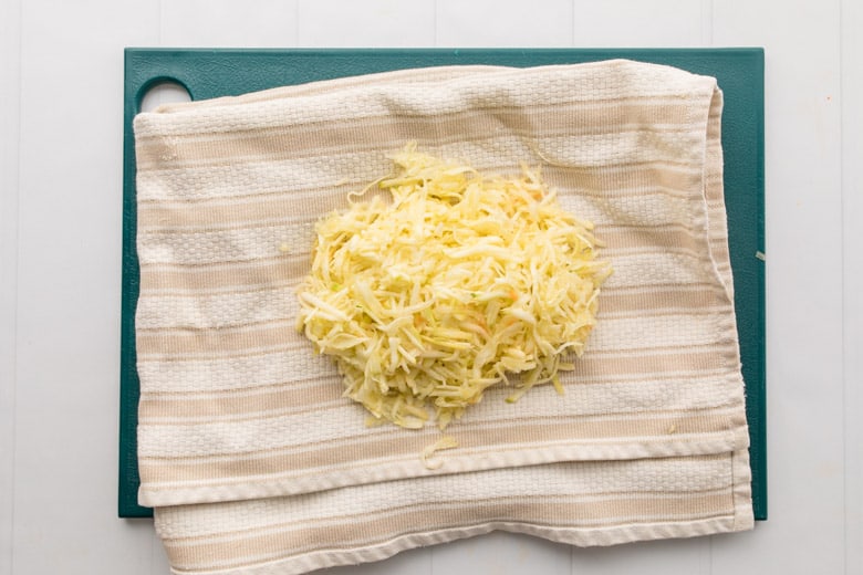 grated zucchini on cloth towel