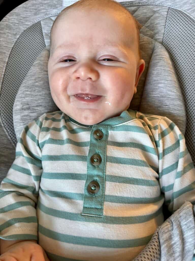 smiling baby in ergo evolve bouncer