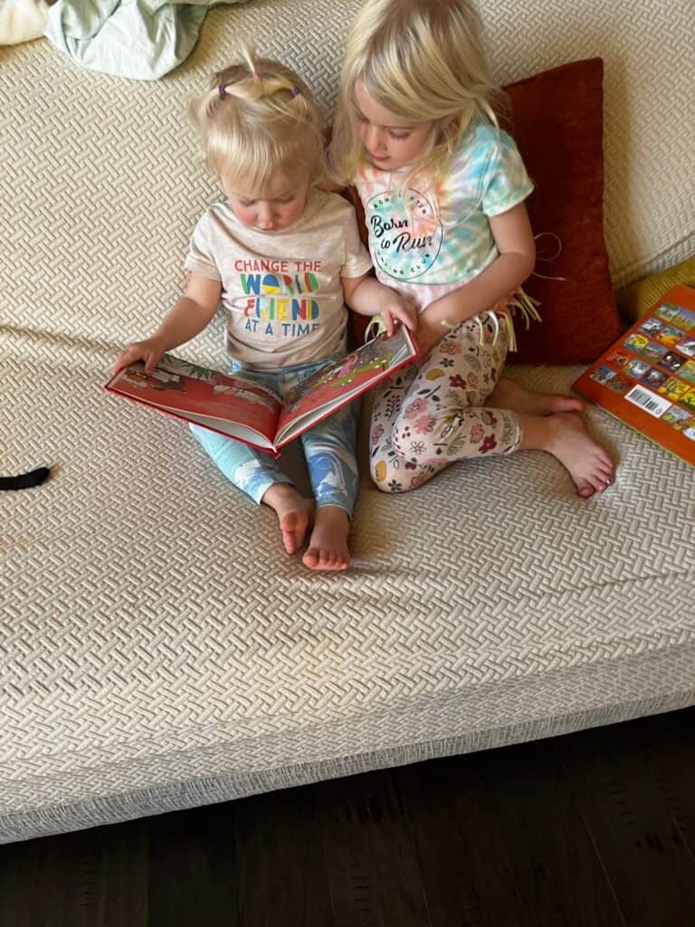 sisters reading book