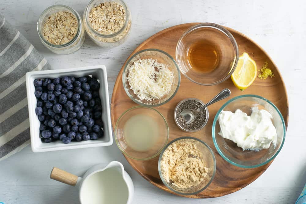 ingredients in specific containers for lemon blueberry overnight oats