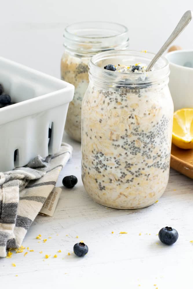 lemon blueberry overnight oats in mason jar on white counter