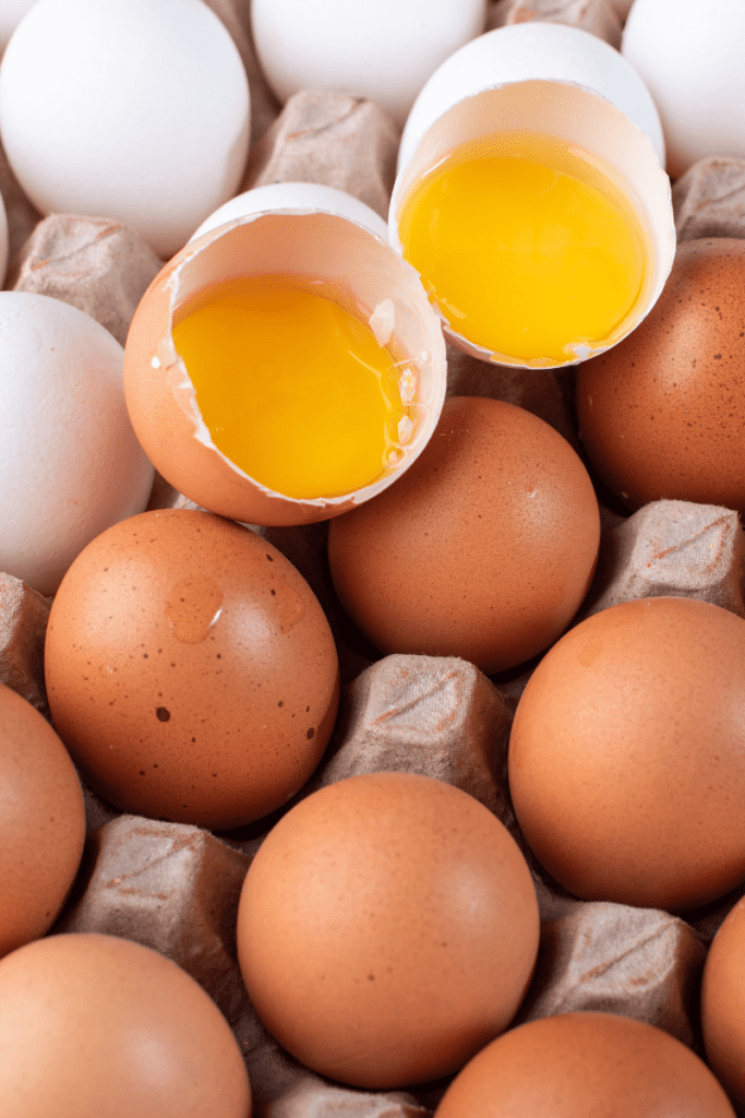 eggs in carton with yolk