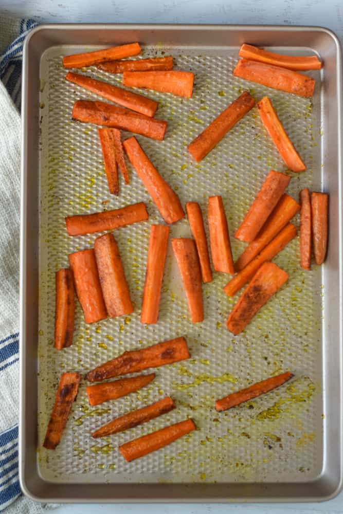 roasted carrot sticks on baking sheet