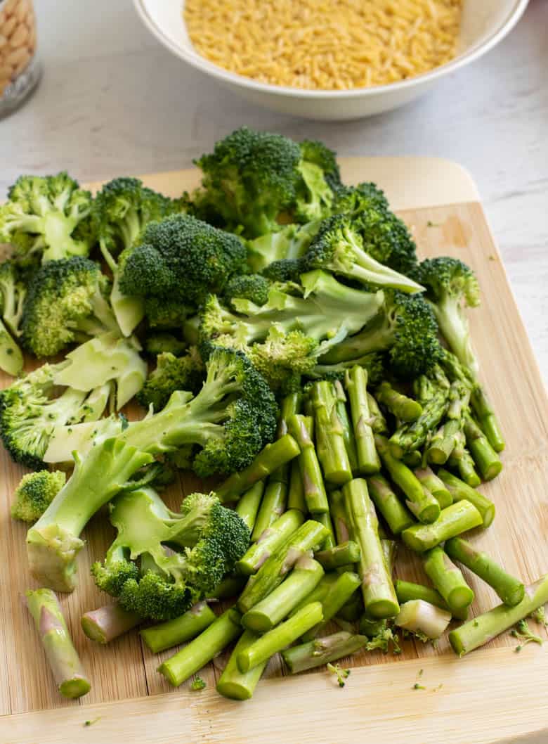 chopped broccoli on wooden cutting board