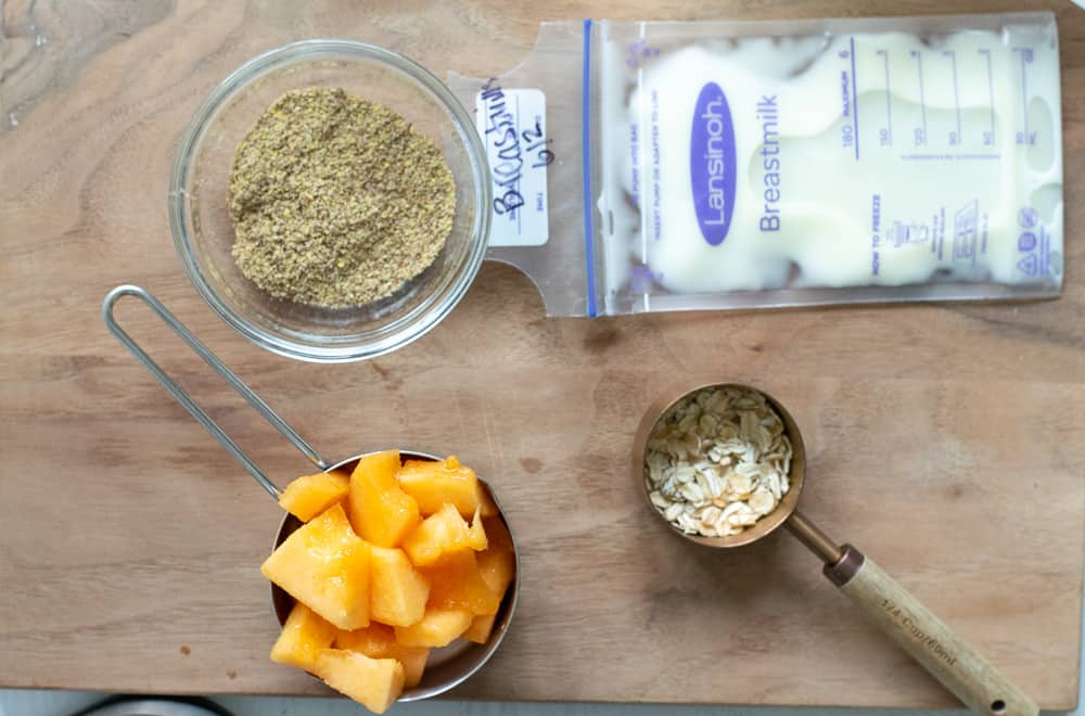 Ingredients for cantaloupe puree on wooden cutting board