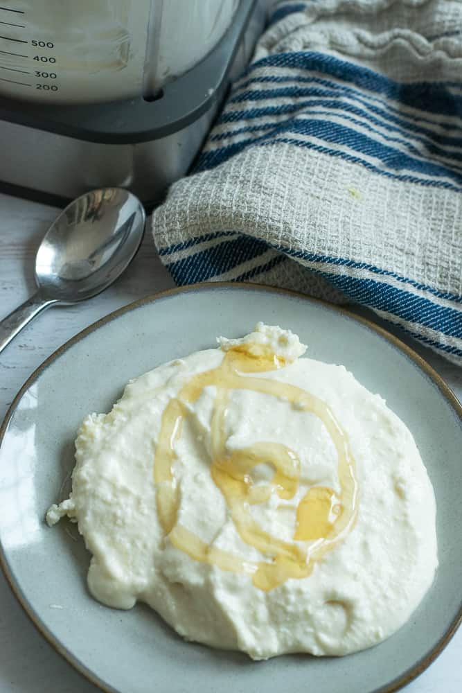 whipped honey feta dip on plate with serving spoon