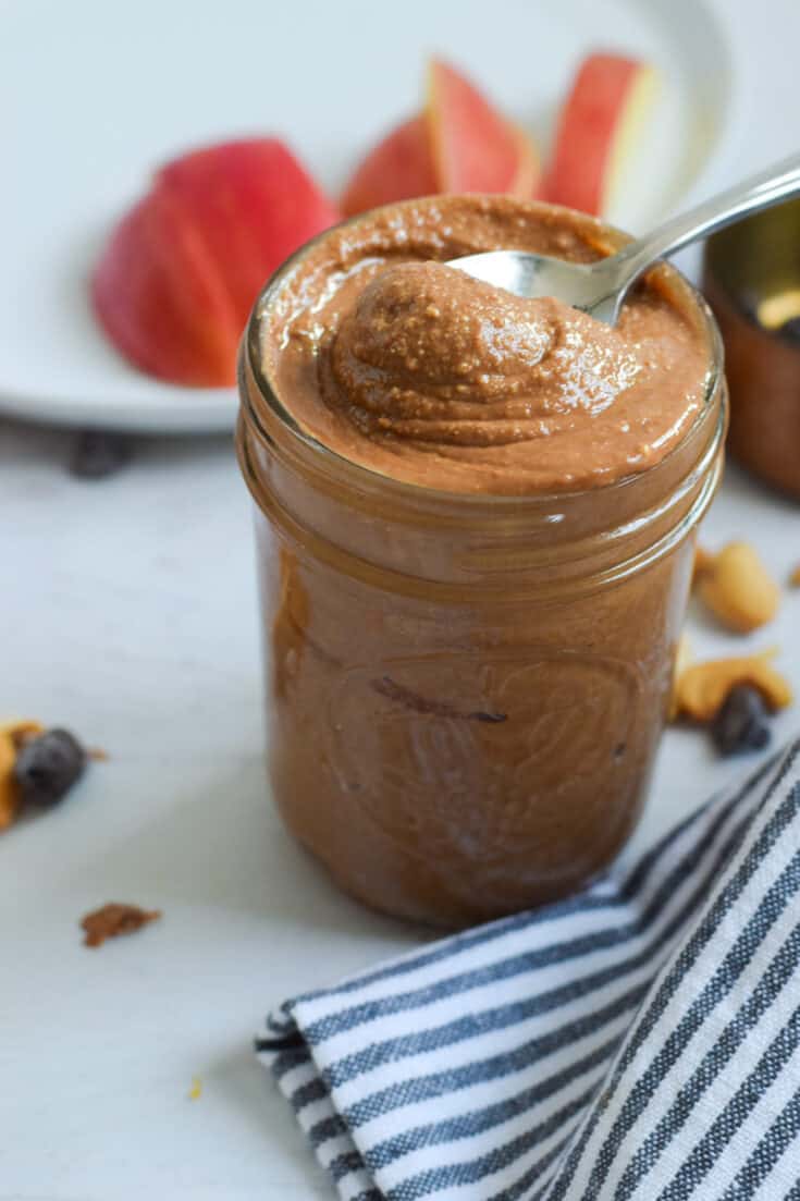 chocolate cashew butter in mason jar with spoon
