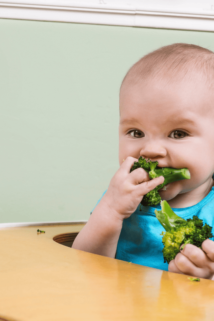 baby eating broccoli florets