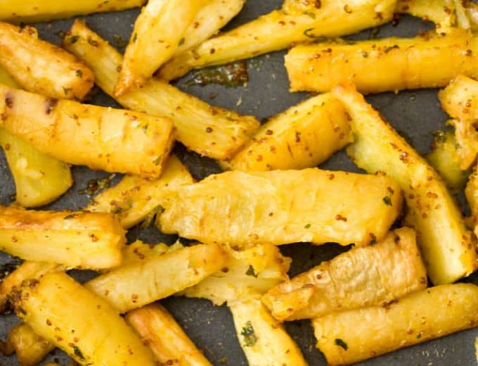 baking sheet with roasted parsnips