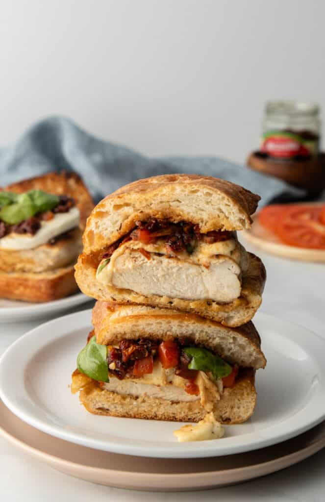 bruschetta chicken sandwich stacked on white plate