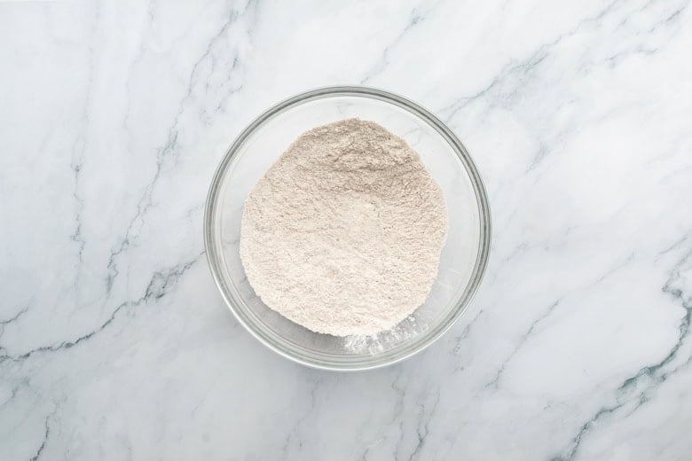 Bowl of flour on marble surface background