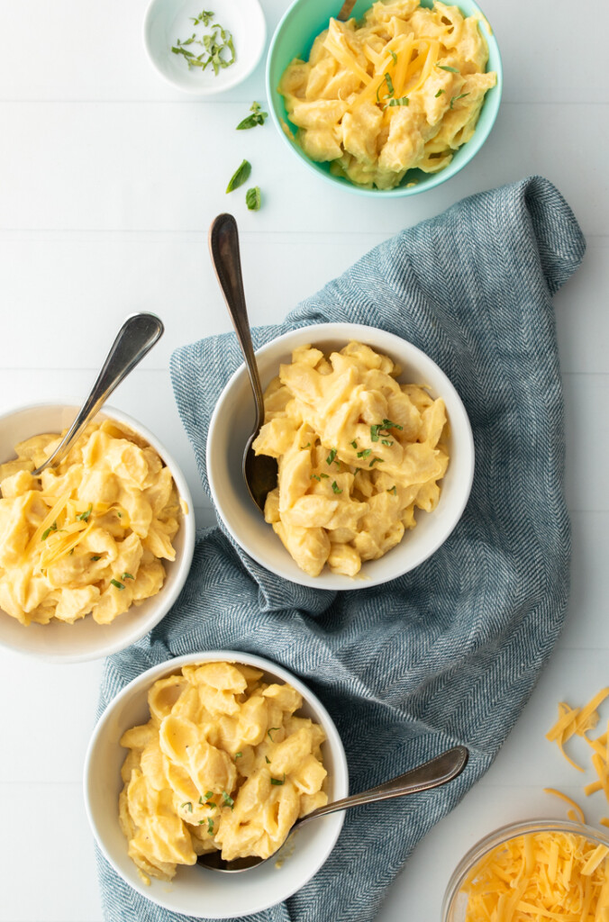 Hidden veggie mac and cheese with 3 pureed veggies in white bowls