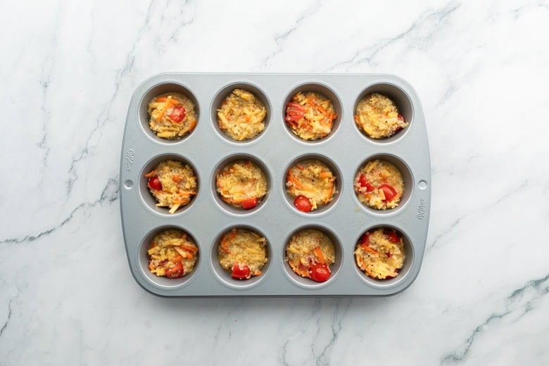 Egg quinoa muffins ready to be baked in baking pan